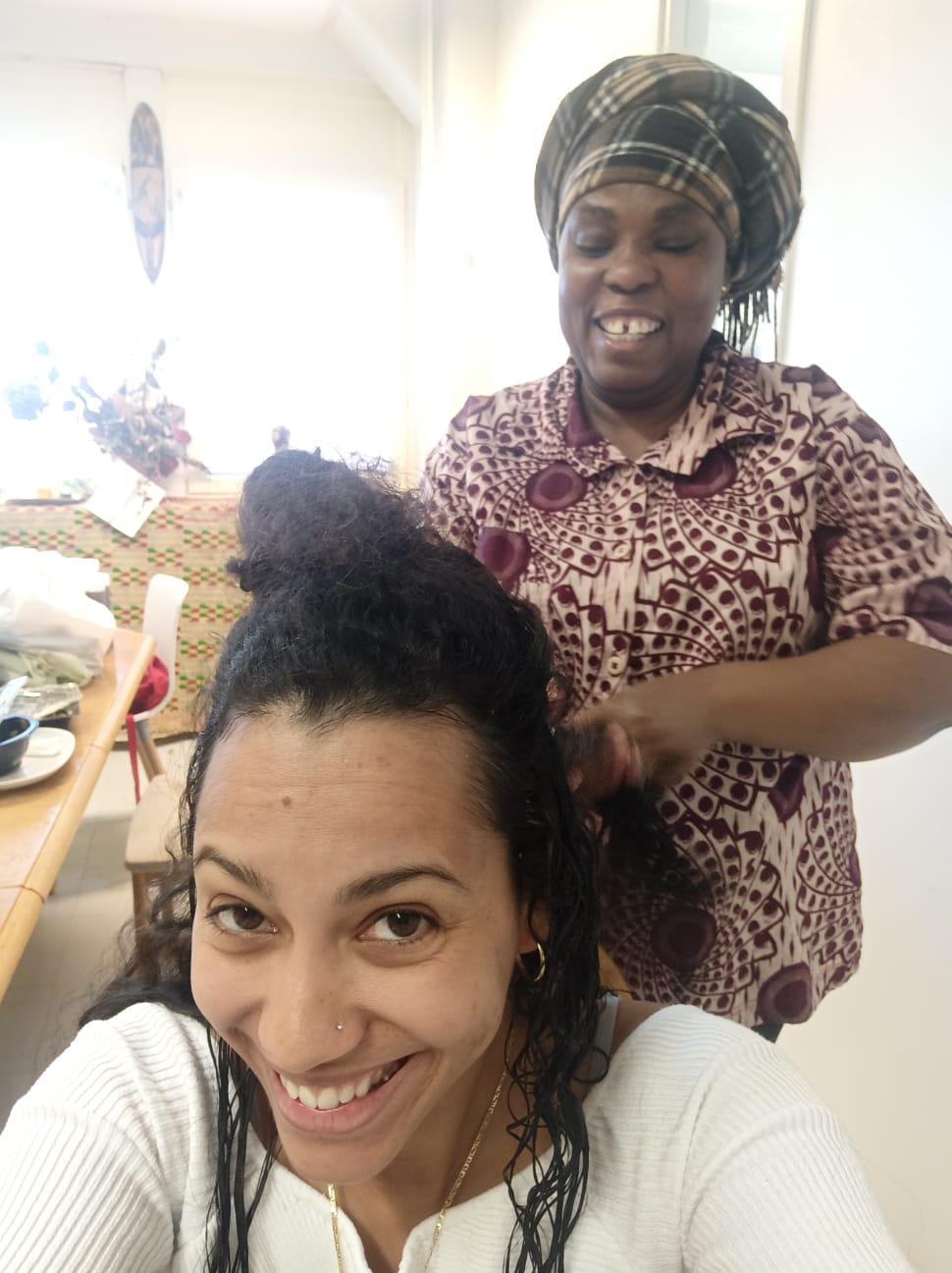 Woman with defined natural curls styled with Inkuto Curl Amplifier Styling Cream